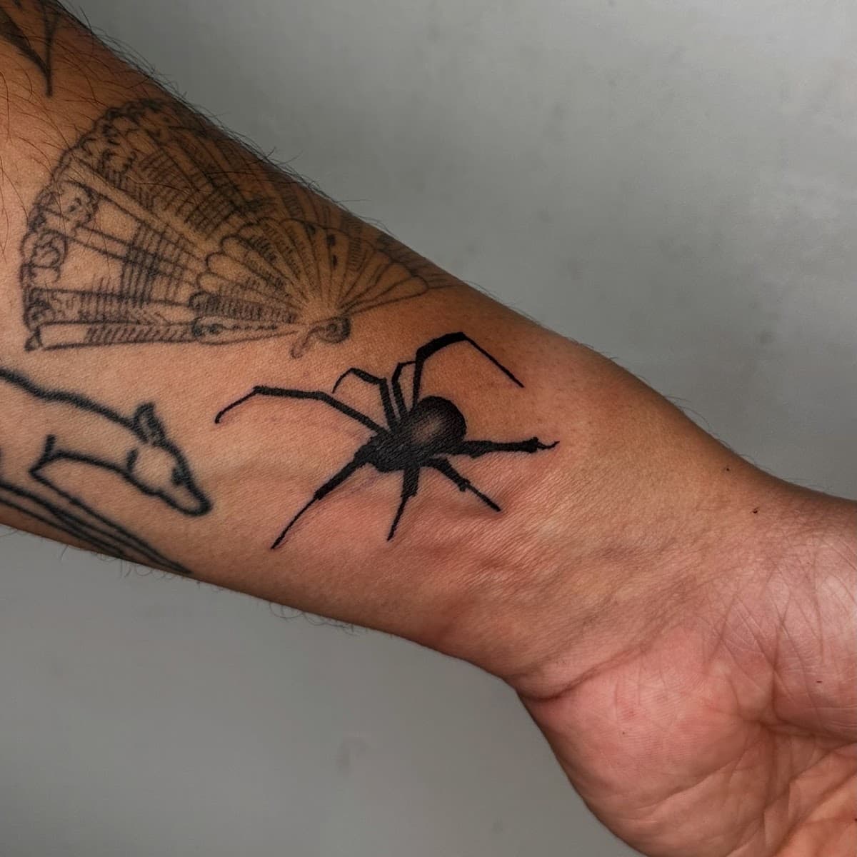 Cosmic sting tattoo