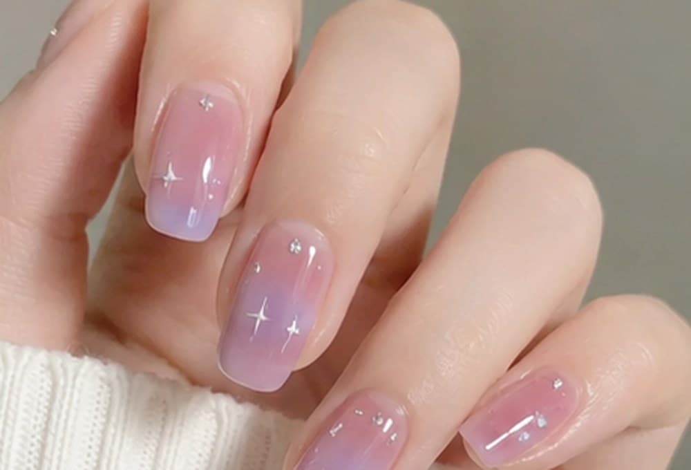 Nails with a sheer base fading into a delicate tip