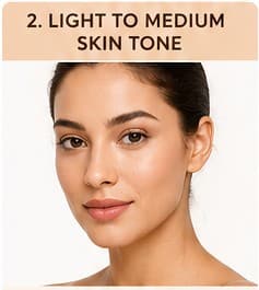 Woman with light to medium skin tone