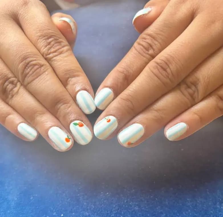 Pastel Blue Minimal Nail Art with Tiny Cherry Accents